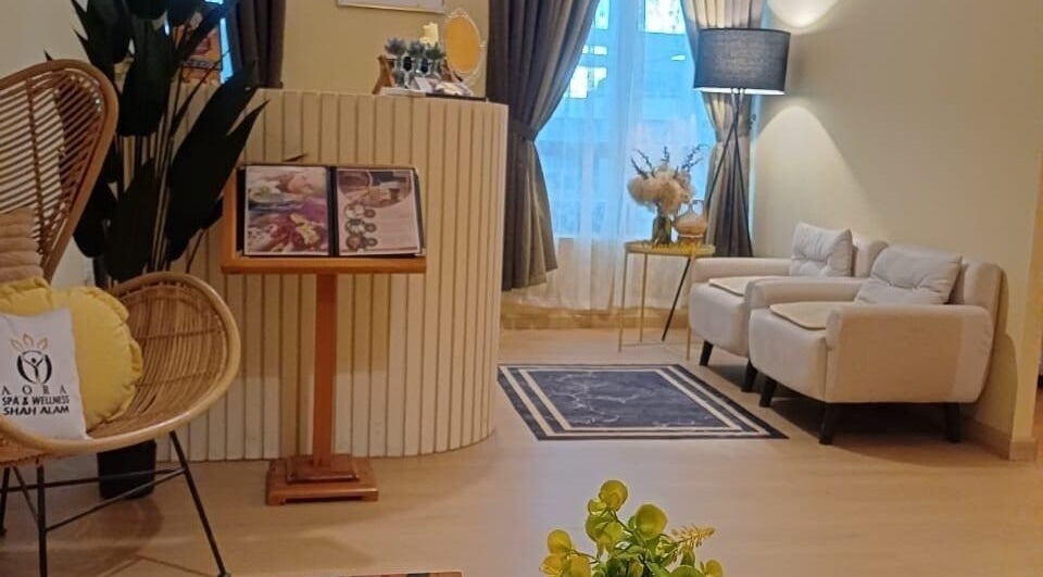 Relaxing reception area at Aora Spa & Wellness Shah Alam, Shah Alam, Selangor, MY with plush seating and decor.