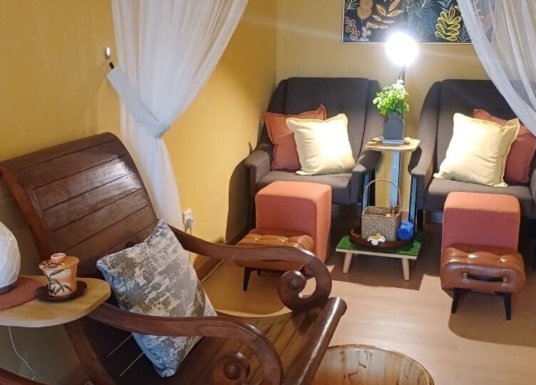 Cozy relaxation area at Aora Spa & Wellness Shah Alam, Shah Alam, Selangor, MY, with armchairs and footrests.