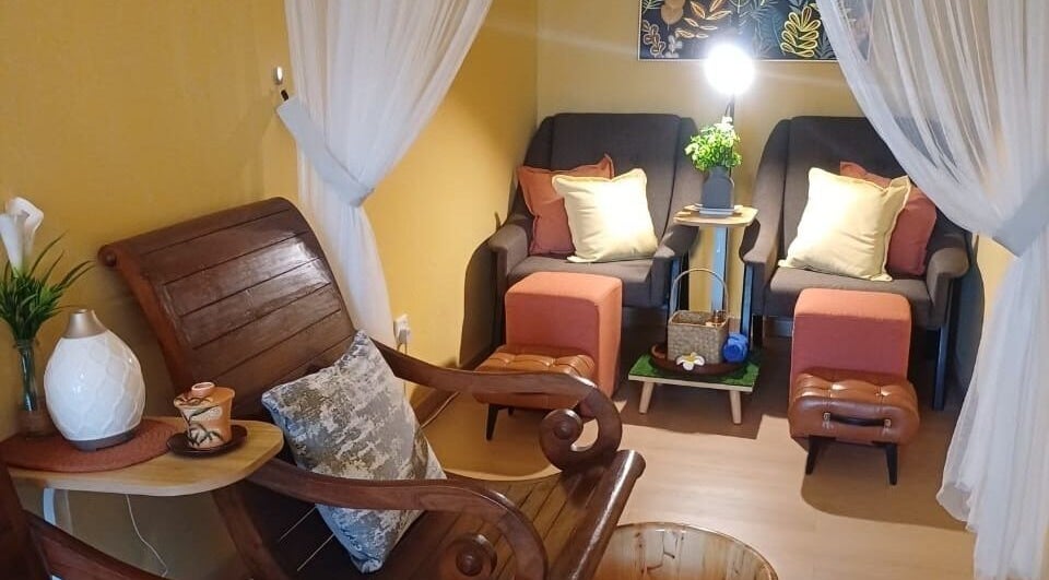 Cozy relaxation area at Aora Spa & Wellness Shah Alam, Shah Alam, Selangor, MY, with armchairs and footrests.