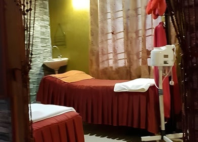 Cozy massage room at AORA Spa and Wellness Sungai Petani, Kedah, MY with a spa bed and tranquil ambiance.