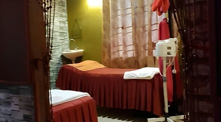 Cozy massage room at AORA Spa and Wellness Sungai Petani, Kedah, MY with a spa bed and tranquil ambiance.