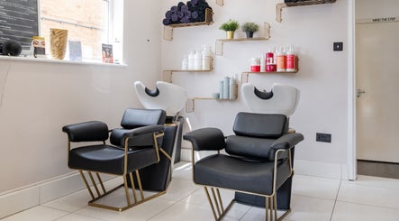 Modern salon chairs and shelves at Salon No. 100 in Bentley Heath, England, GB.