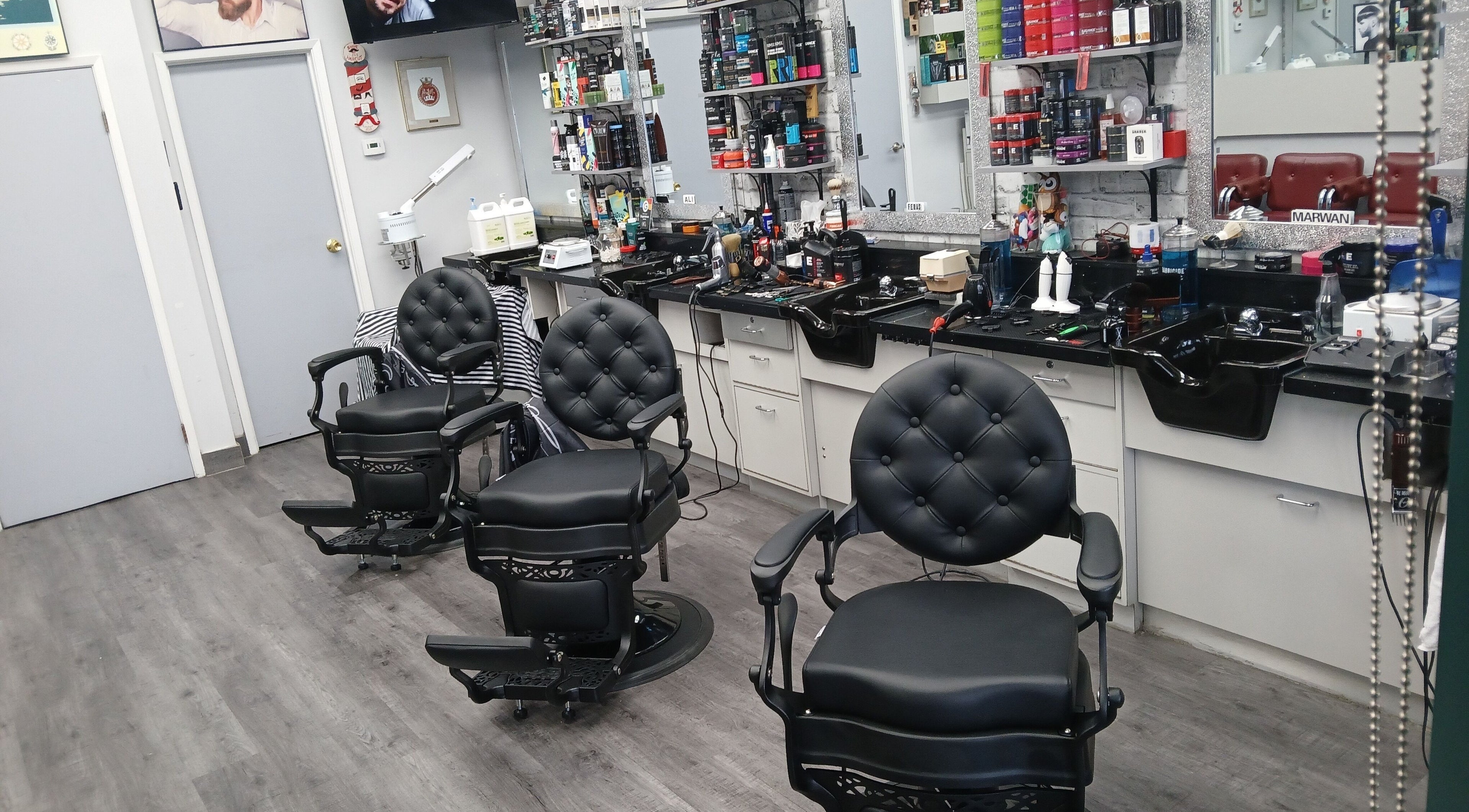 Sherwood Barber ShopGTA features chic barber chairs in Mississauga, Ontario, CA, highlighting sleek interiors.