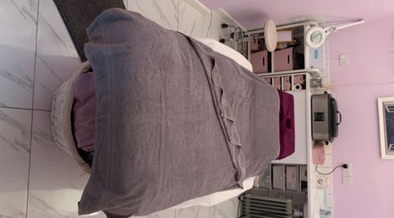 Treatment bed at Holistic Therapy by Kayleigh, Baldock, England, GB, in a calming lavender-toned room.