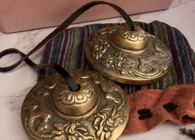 Decorative brass chimes at Holistic Therapy by Kayleigh in Baldock, England, GB enhance the wellness ambiance.