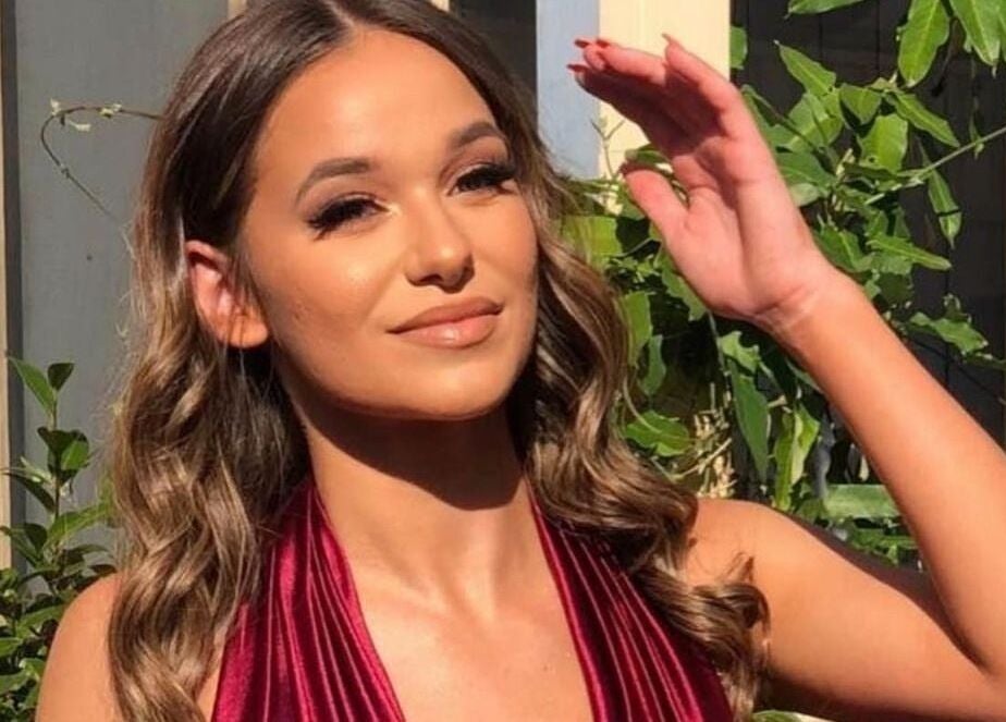 A woman enjoying sunlight at Glow by Hayley in Kellyville, New South Wales, AU for beauty and wellness.