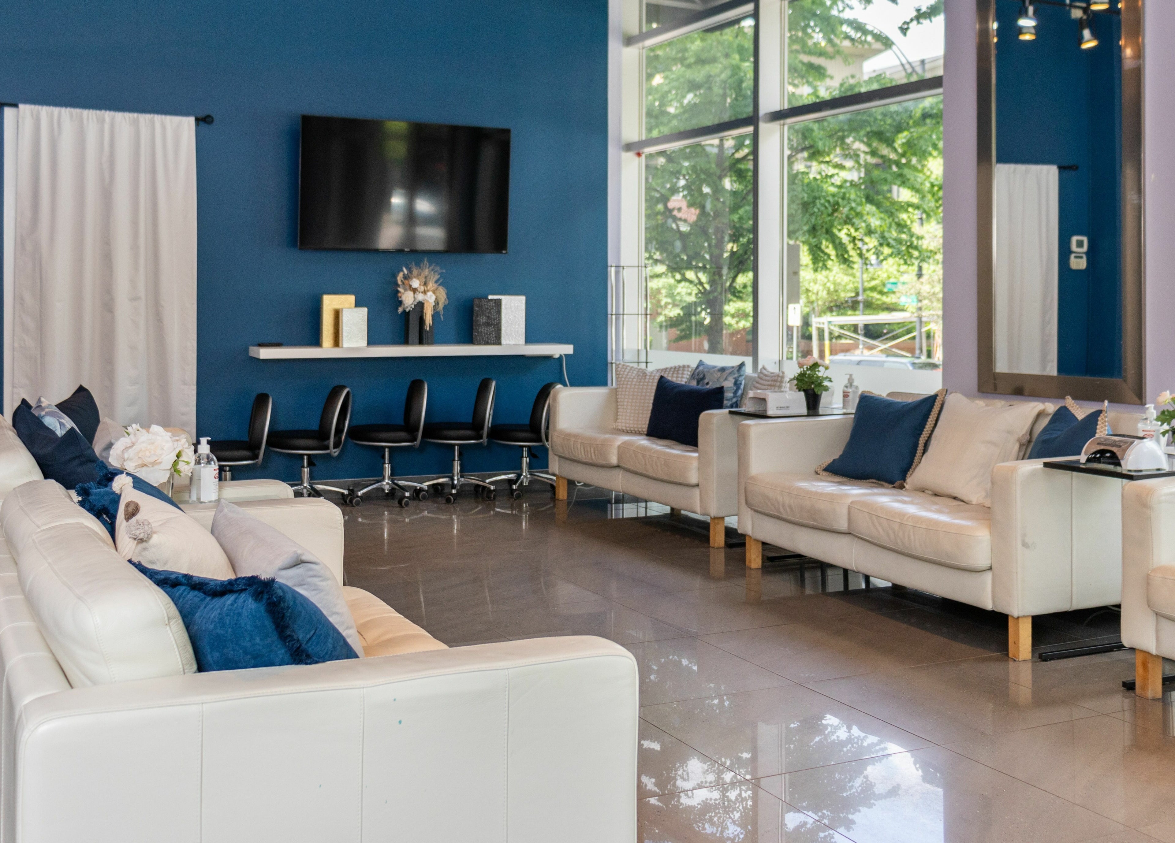 Elegant waiting area at The Inlet Nail Studio, Port Moody, British Columbia, CA with plush seating.