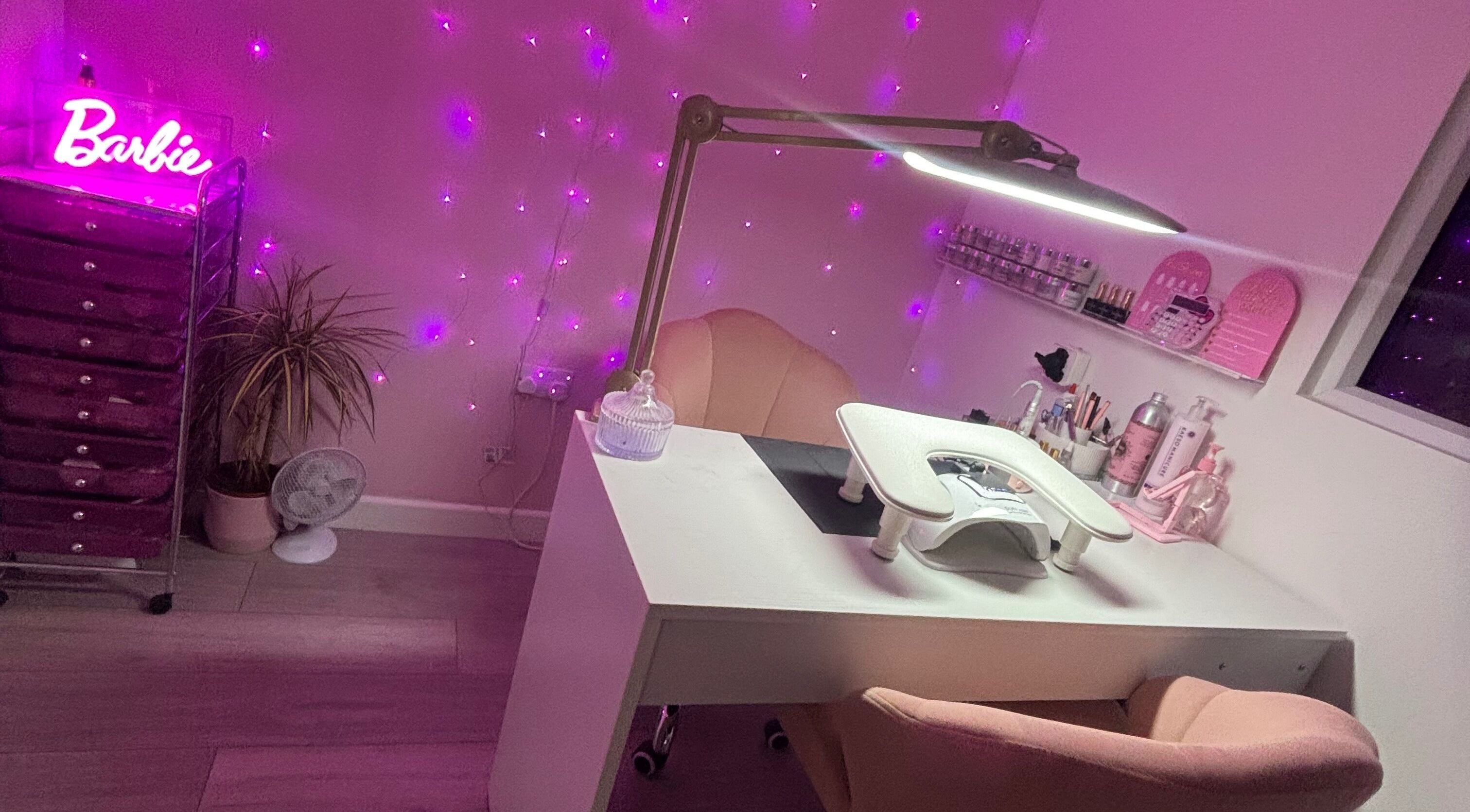 Chic nail station at Barbiebeautybtn, Brighton And Hove, England, GB with pink ambiance and LED lights.