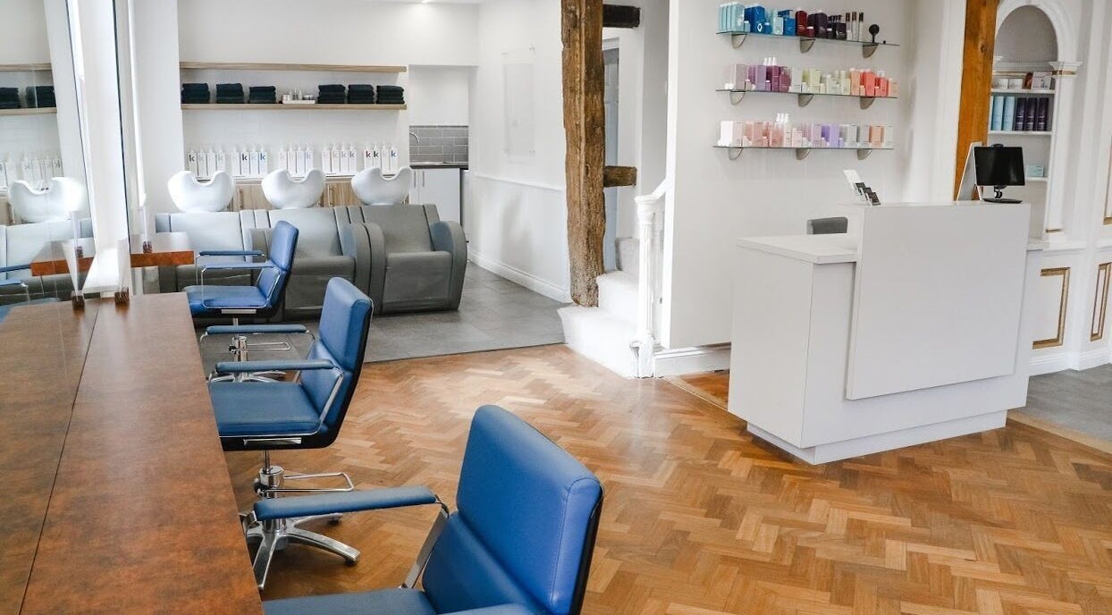 Chic beauty salon interior at Tonics, Horsham, England, GB with stylish chairs and sleek decor.