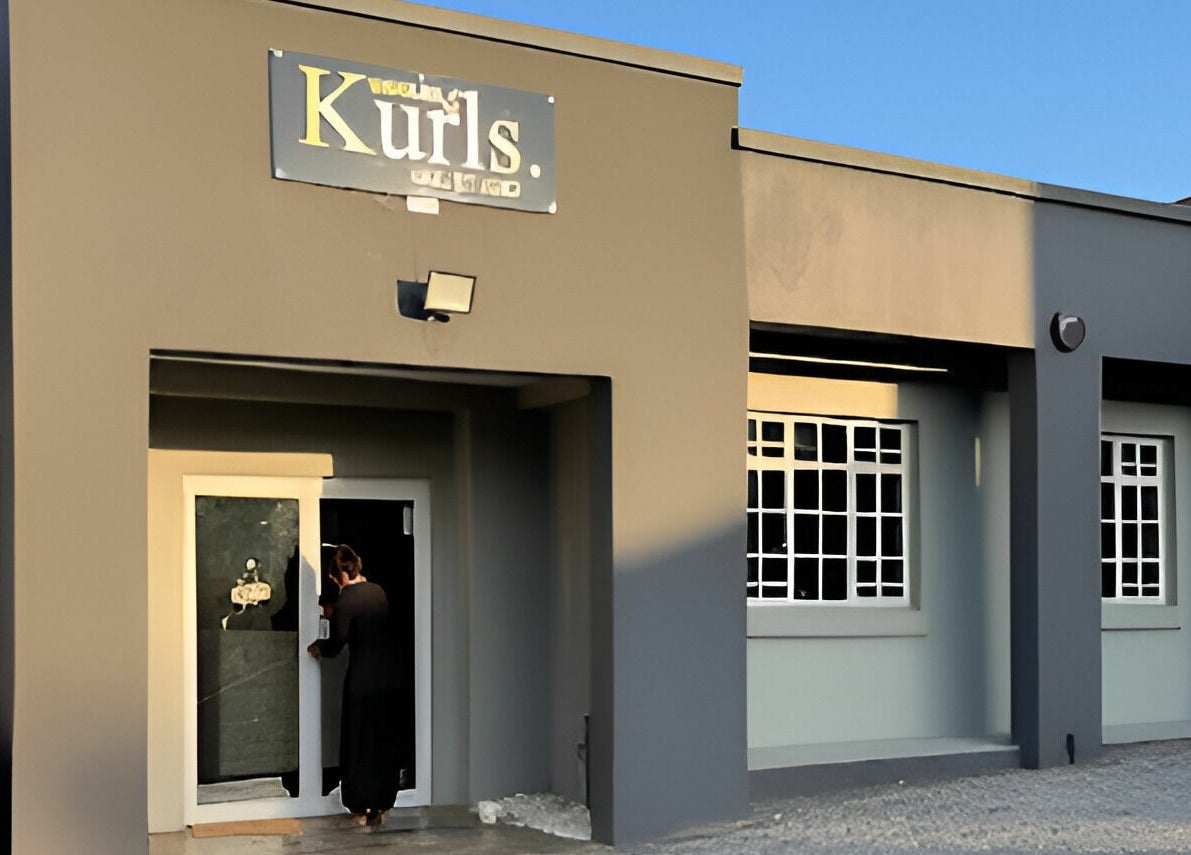Entrance of Giggles n Kurls Nail Studio Midrand, located in Midrand, Gauteng, ZA, with a customer entering.
