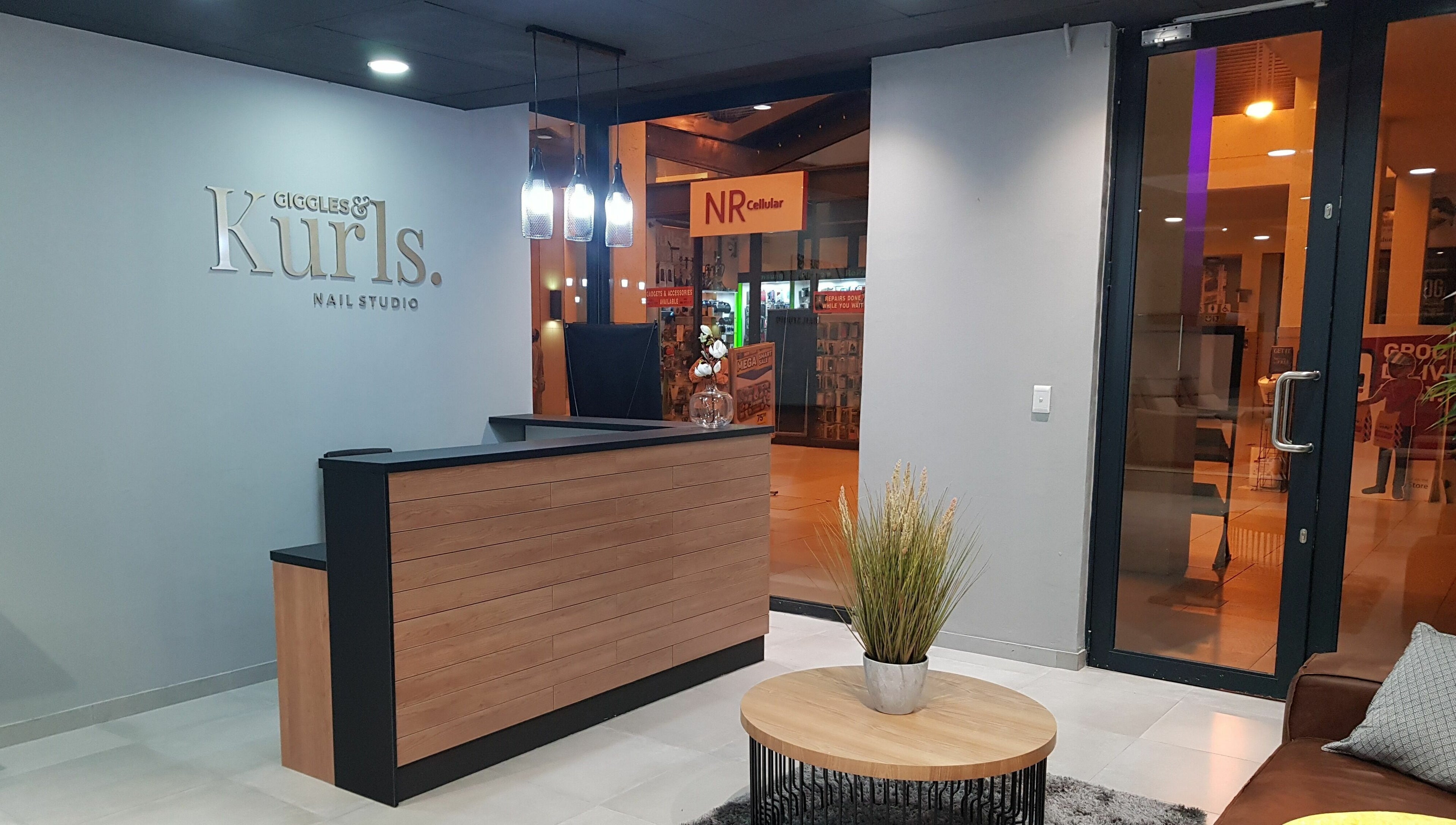 Reception area of Giggles n Kurls Nail Studio Bryanston, Sandton, Gauteng, ZA with elegant decor.
