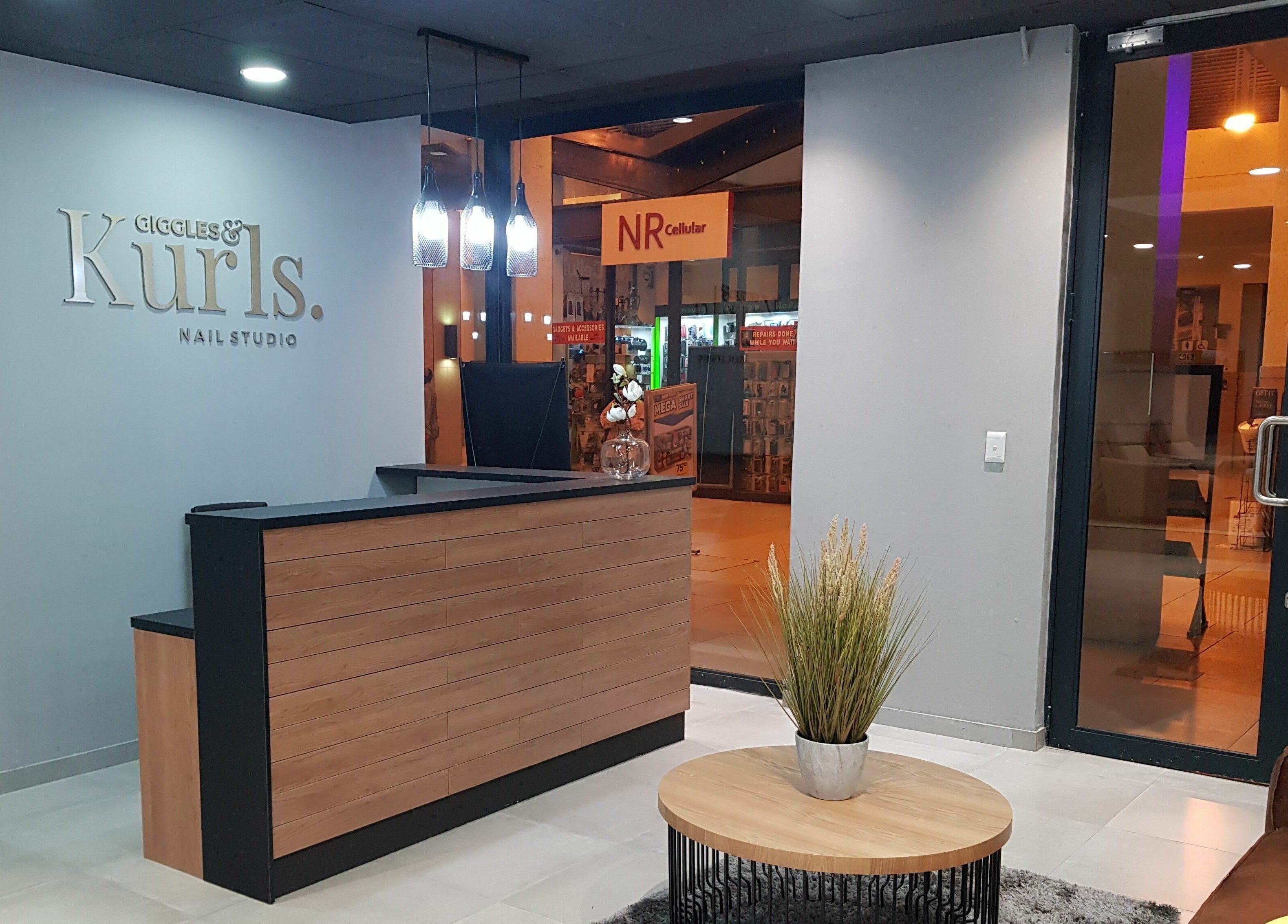 Reception area of Giggles n Kurls Nail Studio Bryanston, Sandton, Gauteng, ZA with elegant decor.