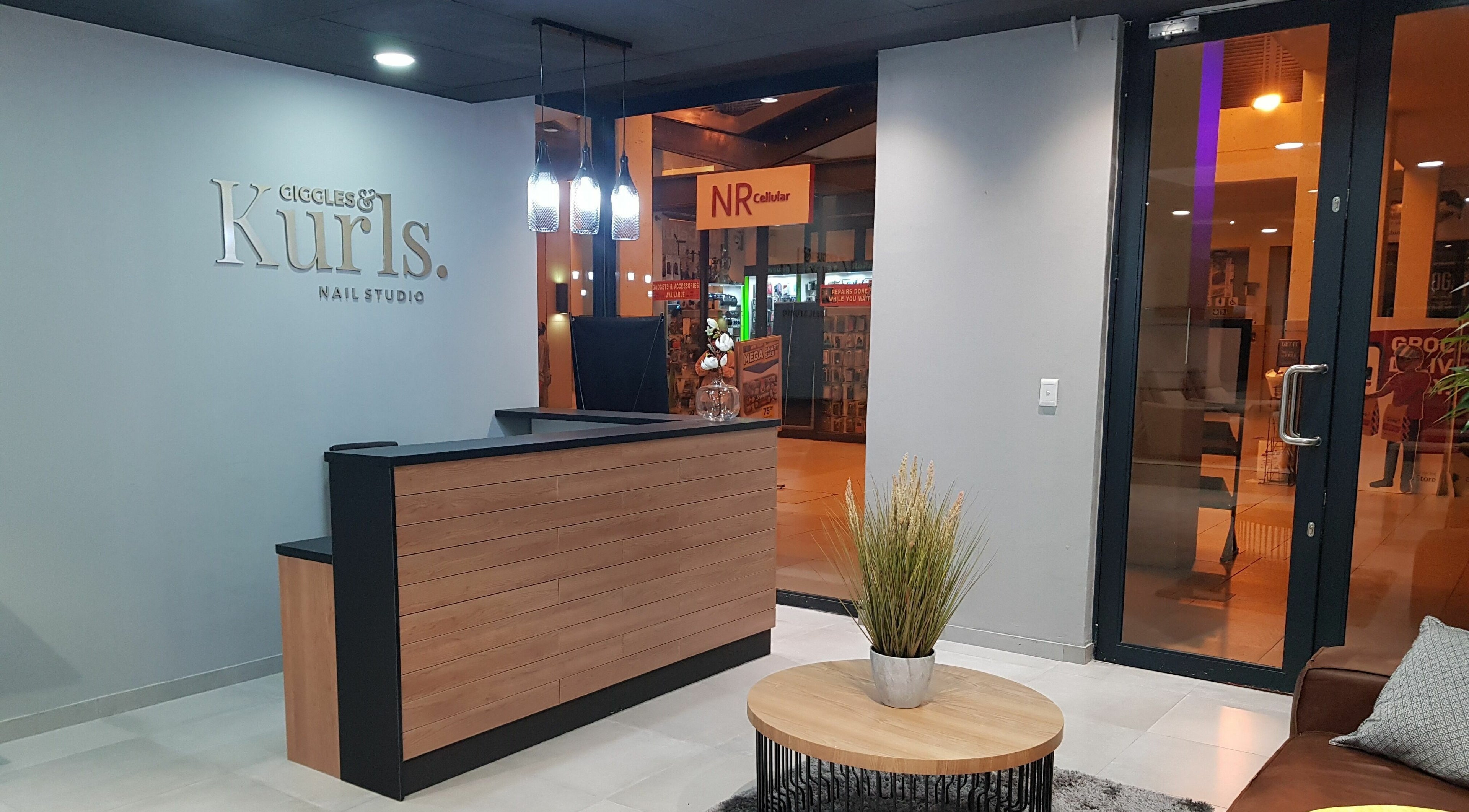 Reception area of Giggles n Kurls Nail Studio Bryanston, Sandton, Gauteng, ZA with elegant decor.