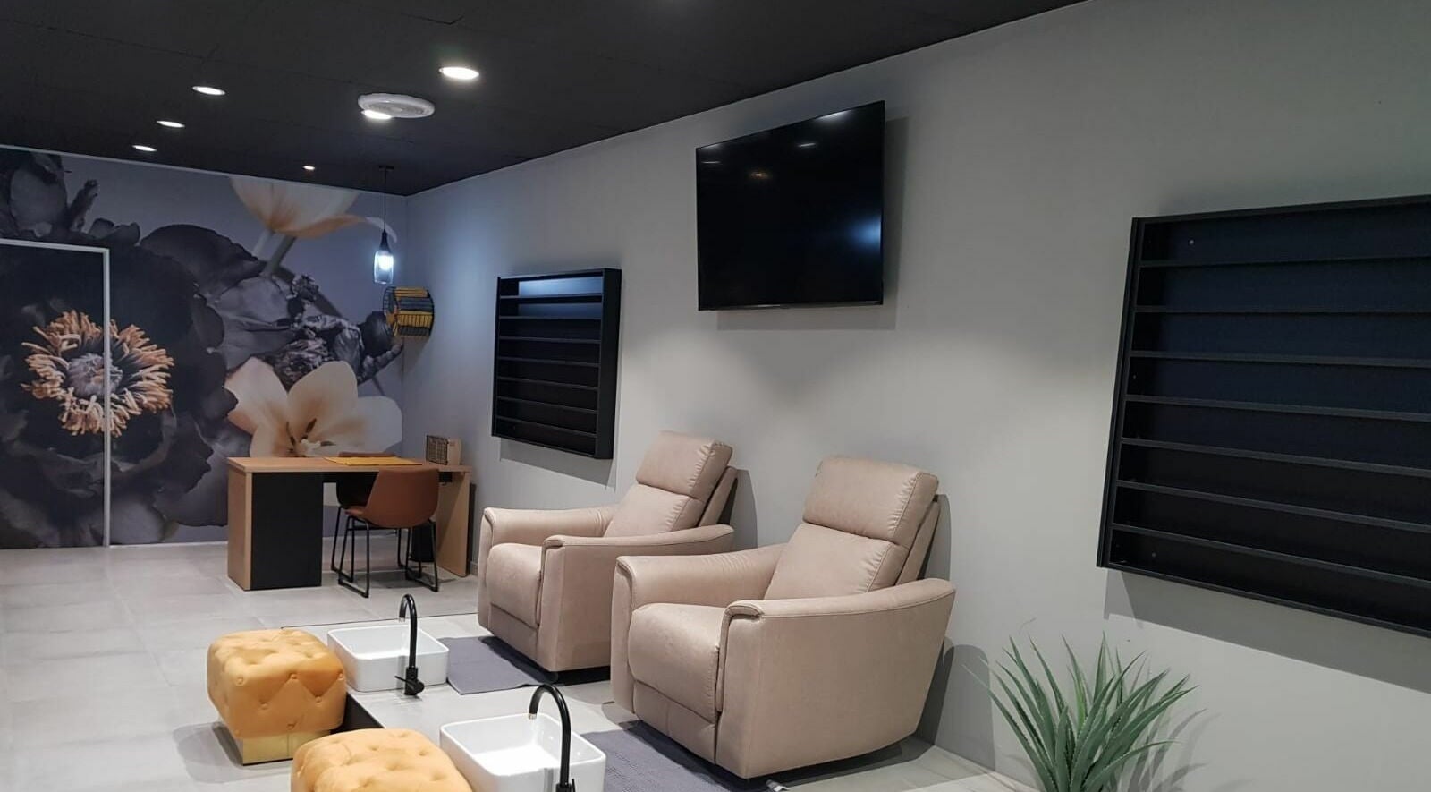 Chic interior of Giggles n Kurls Nail Studio Bryanston, Sandton, Gauteng, ZA with plush seating and floral decor.