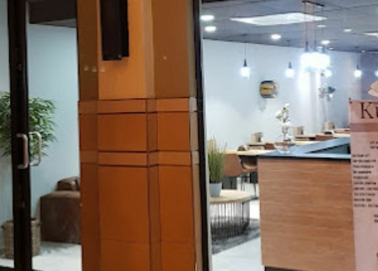 Entrance to Giggles n Kurls Nail Studio Bryanston, Sandton, Gauteng, ZA with stylish interior visible.