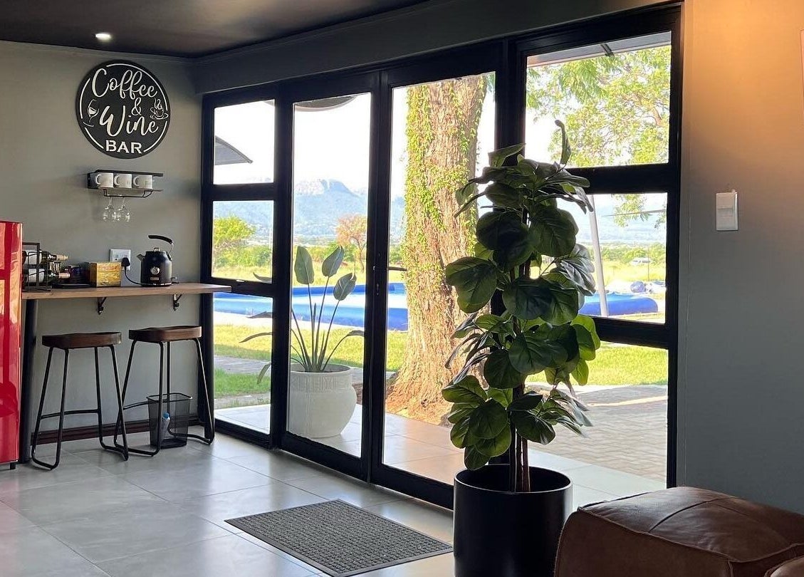 Cozy lounge area with garden view at Giggles n Kurls Nail Studio Hartbeespoort, North West, ZA.