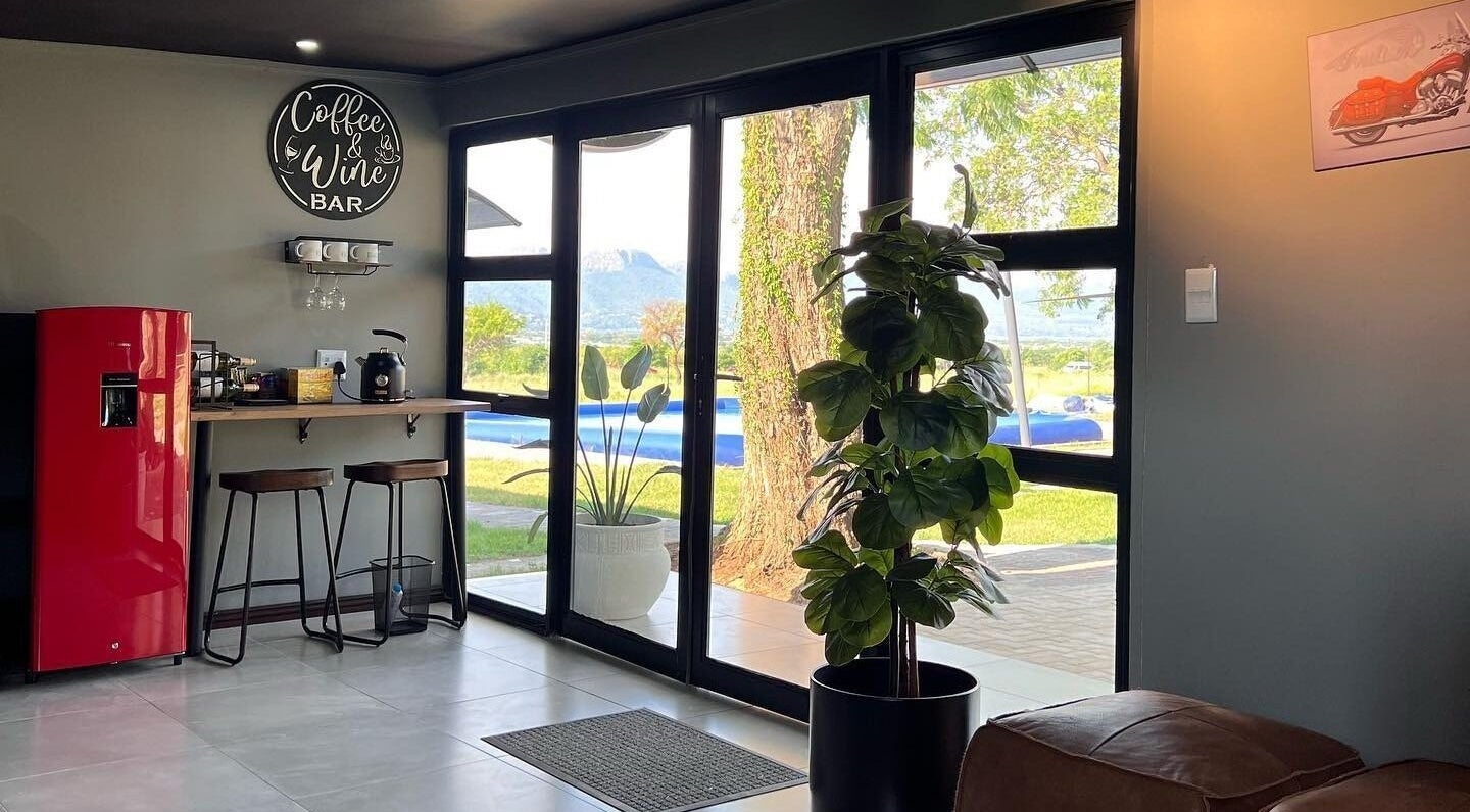 Cozy lounge area with garden view at Giggles n Kurls Nail Studio Hartbeespoort, North West, ZA.