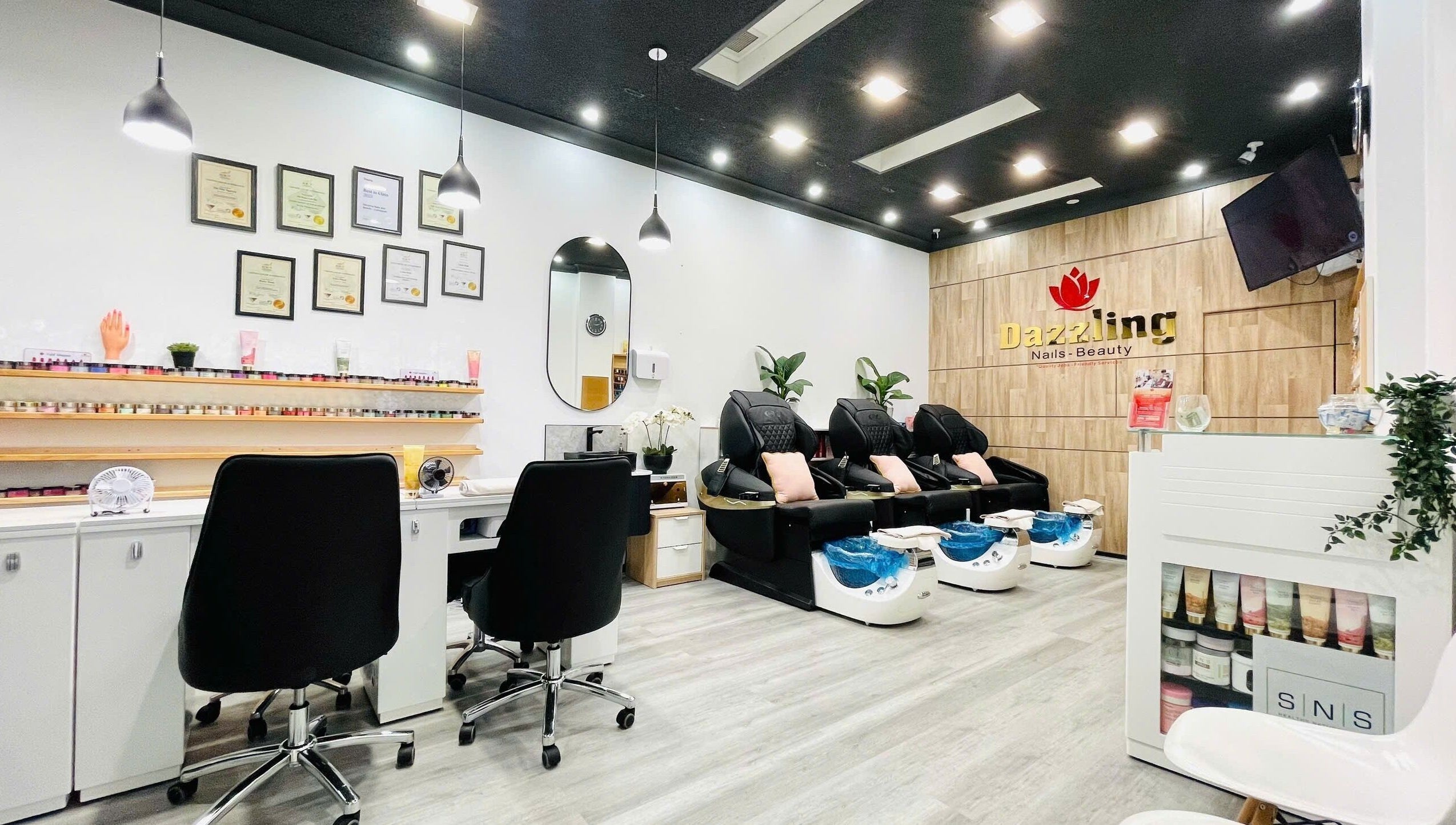 Chic interior of Dazzling Nails and Beauty in Caringbah, New South Wales, AU with modern pedicure chairs.