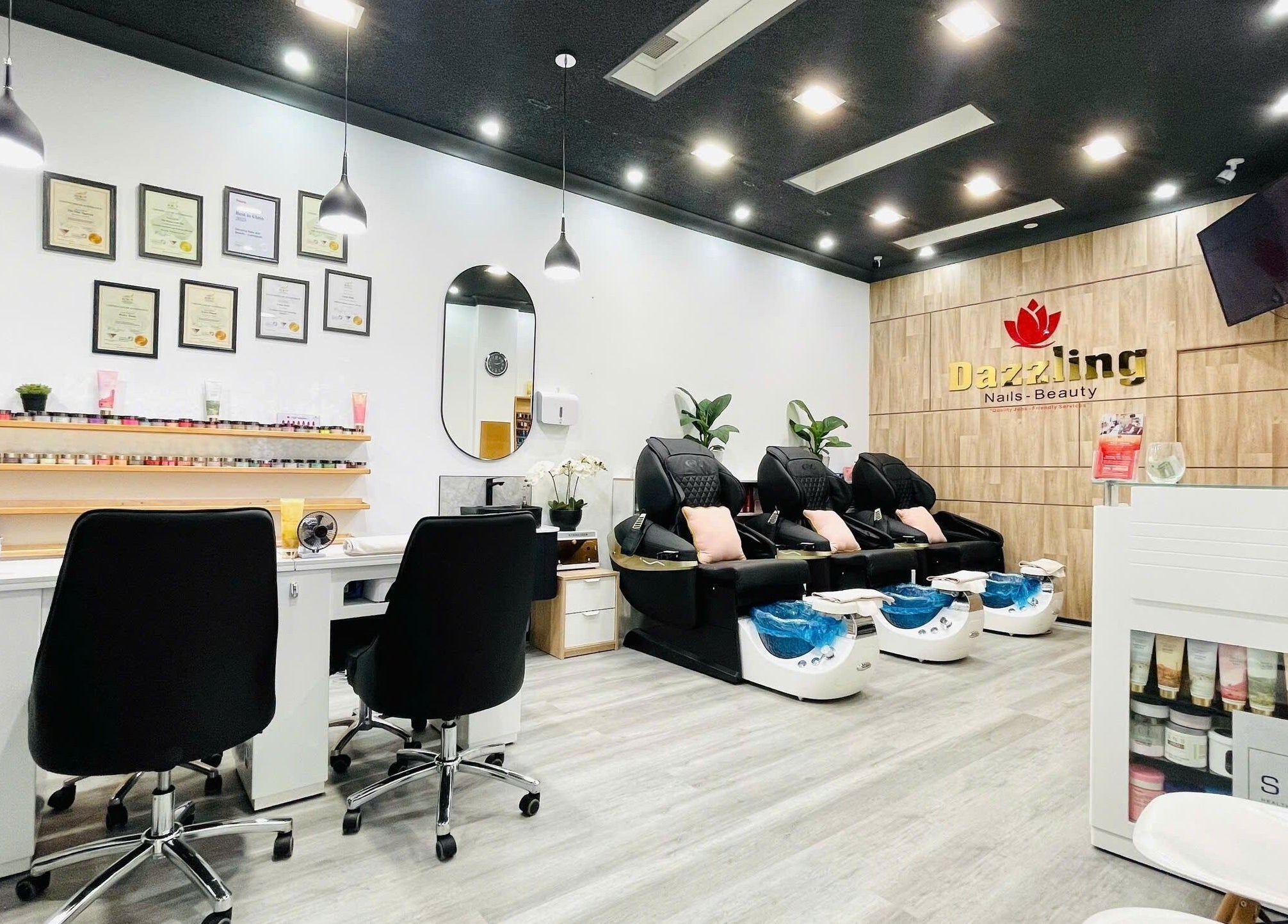 Chic interior of Dazzling Nails and Beauty in Caringbah, New South Wales, AU with modern pedicure chairs.