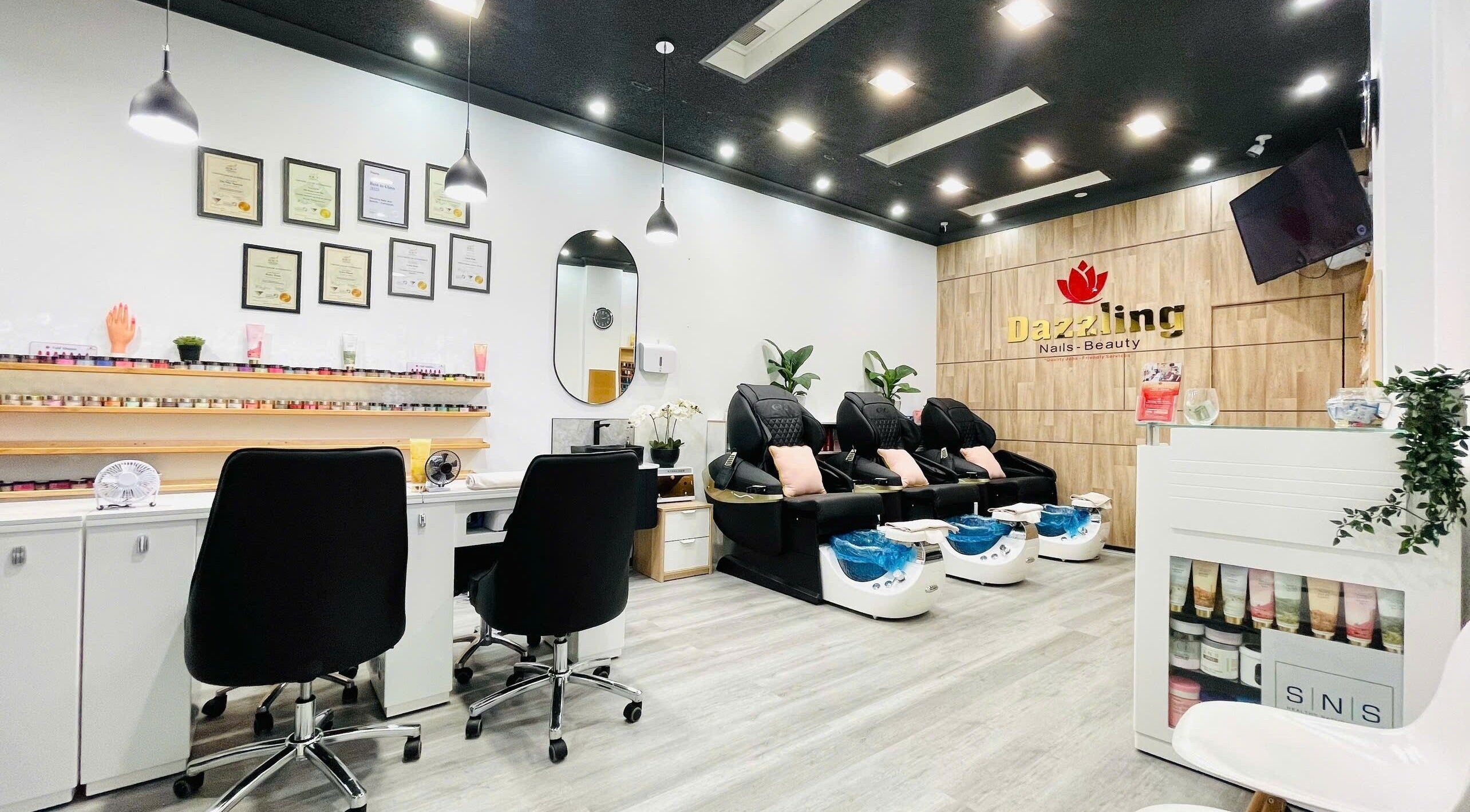 Chic interior of Dazzling Nails and Beauty in Caringbah, New South Wales, AU with modern pedicure chairs.