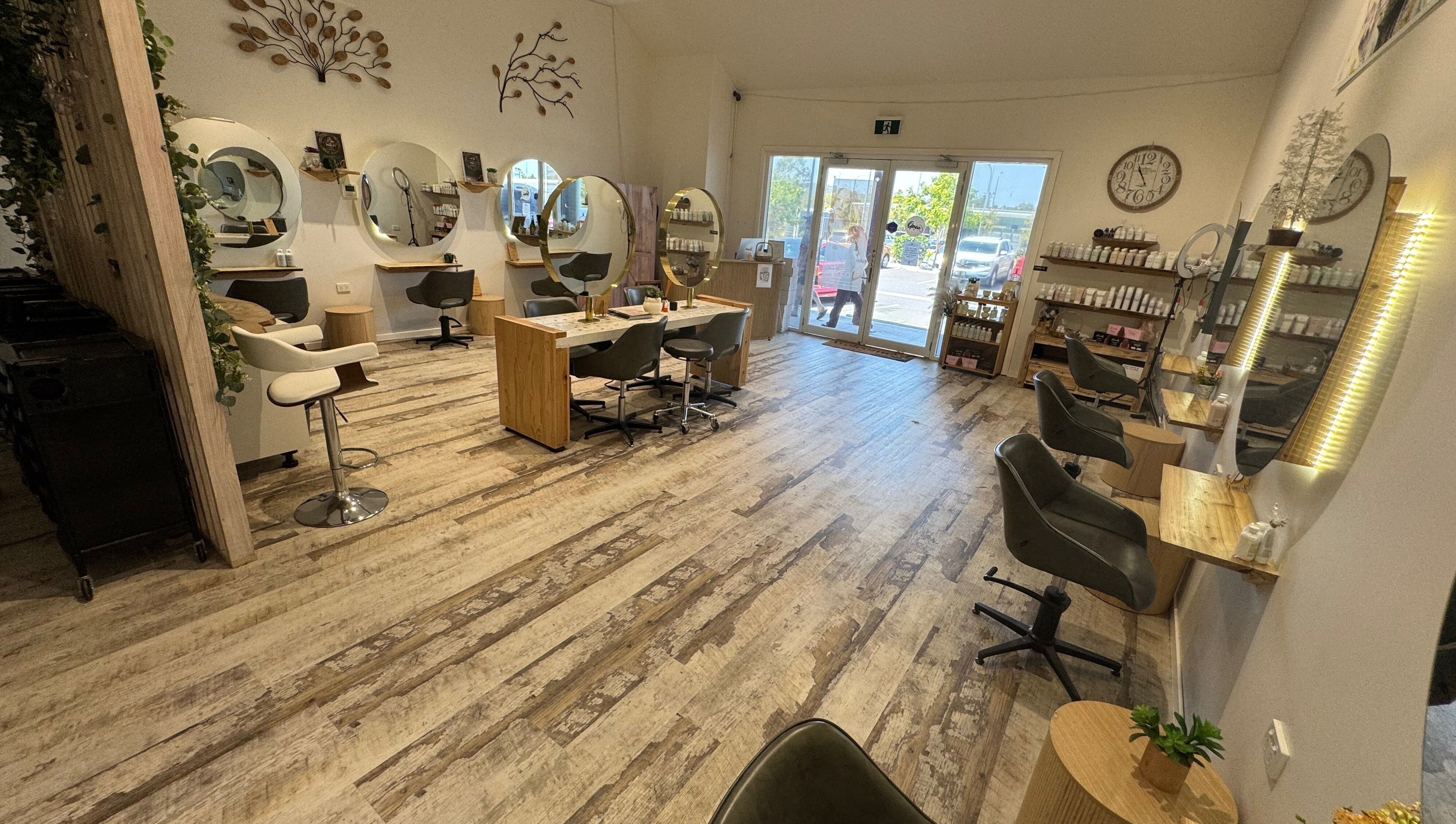 Modern interior of Boho Boutique Hair Salon in Yarrabilba, Queensland, AU with stylish stations and decor.