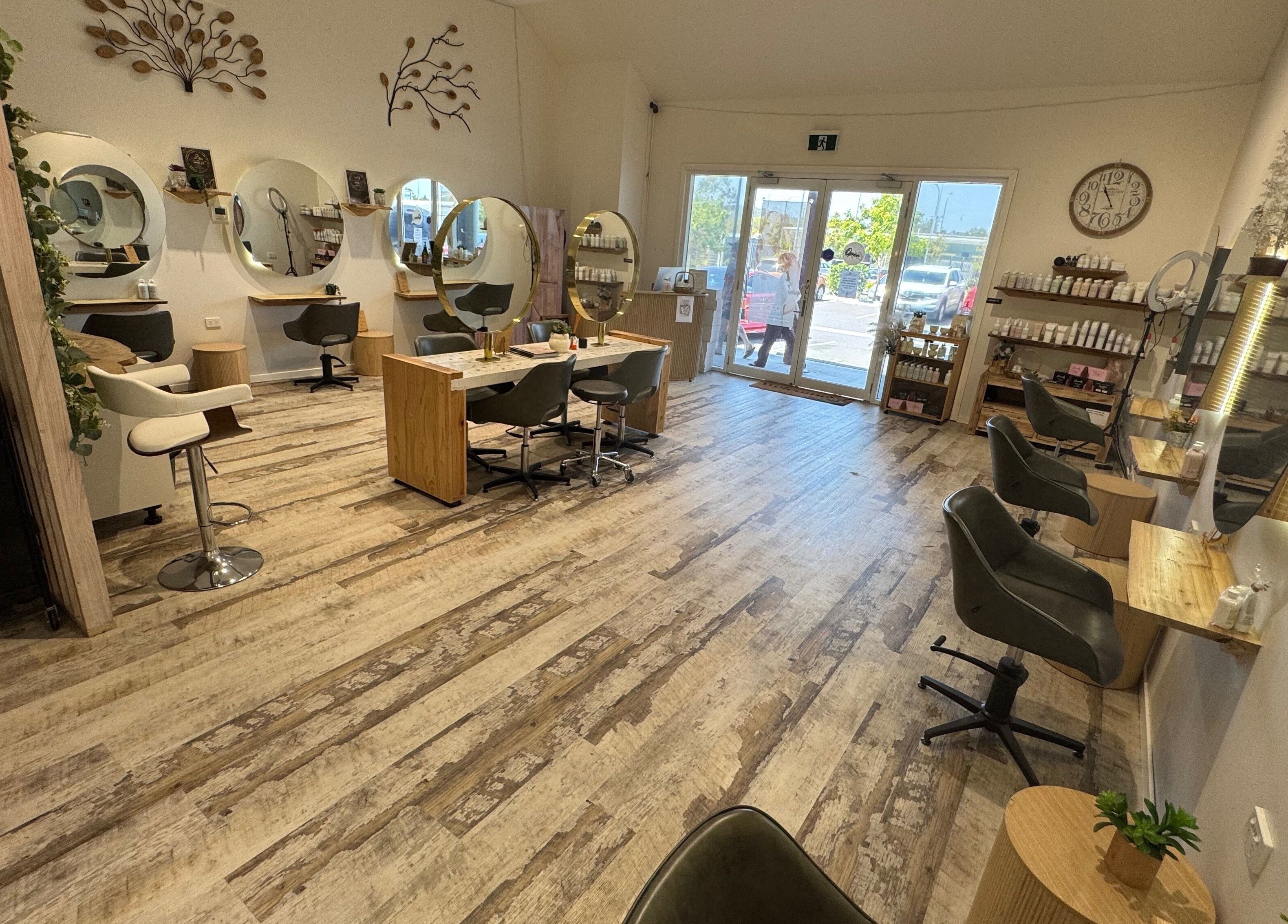 Modern interior of Boho Boutique Hair Salon in Yarrabilba, Queensland, AU with stylish stations and decor.