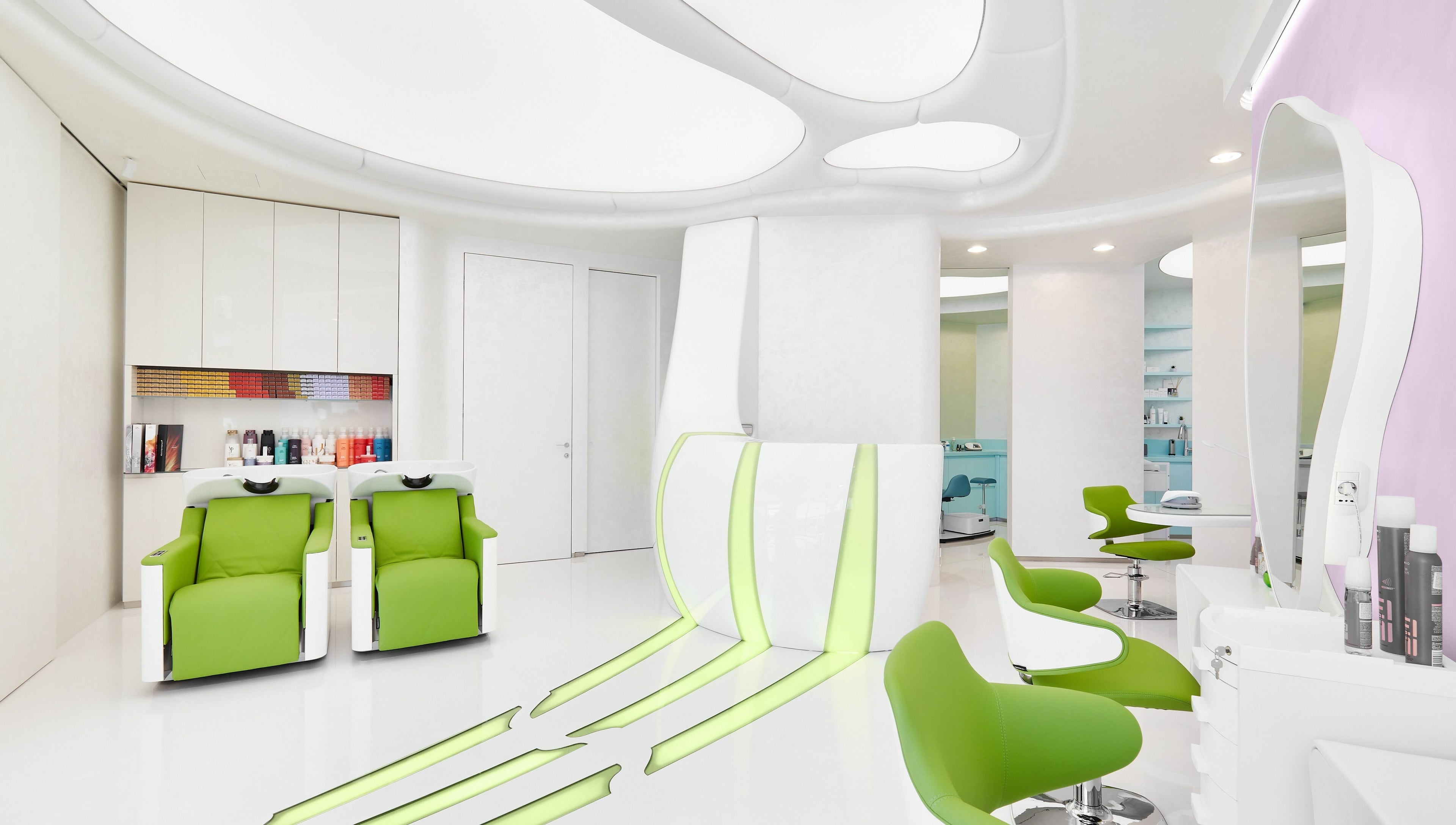 Chic interior of Hairspray salon in Sofia, Sofia City Province, BG with sleek green chairs and stylish decor.