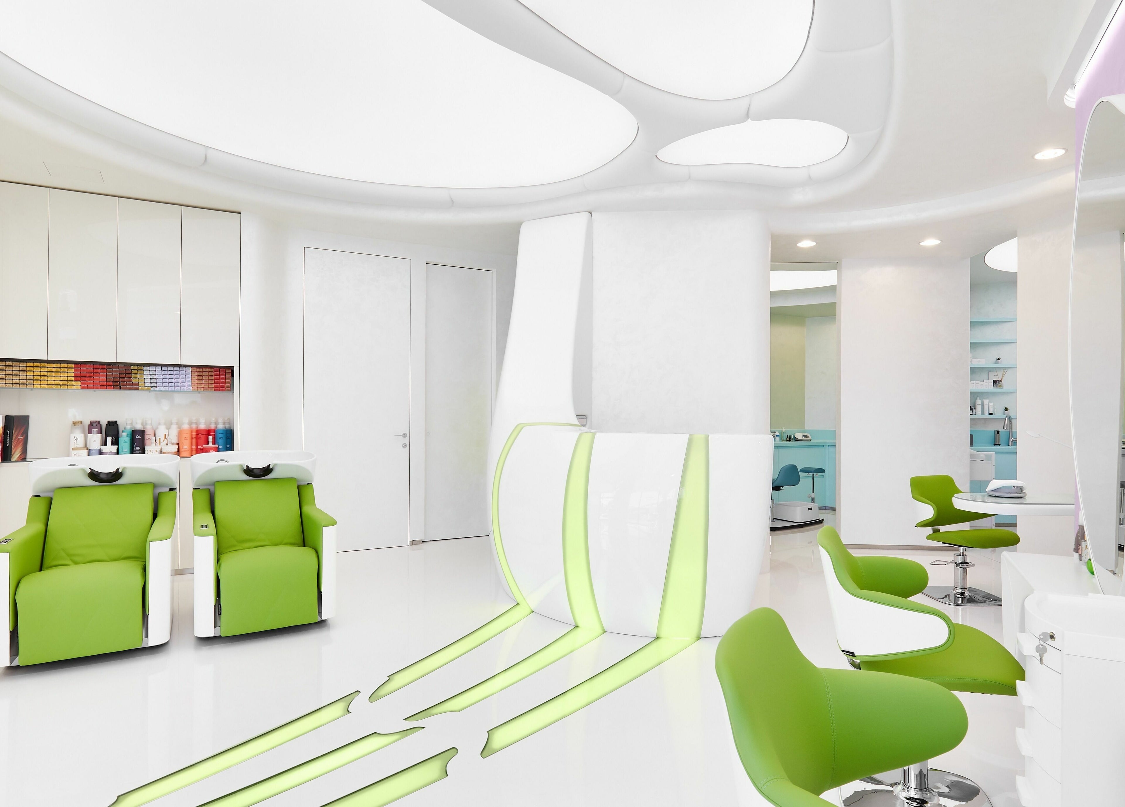 Chic interior of Hairspray salon in Sofia, Sofia City Province, BG with sleek green chairs and stylish decor.