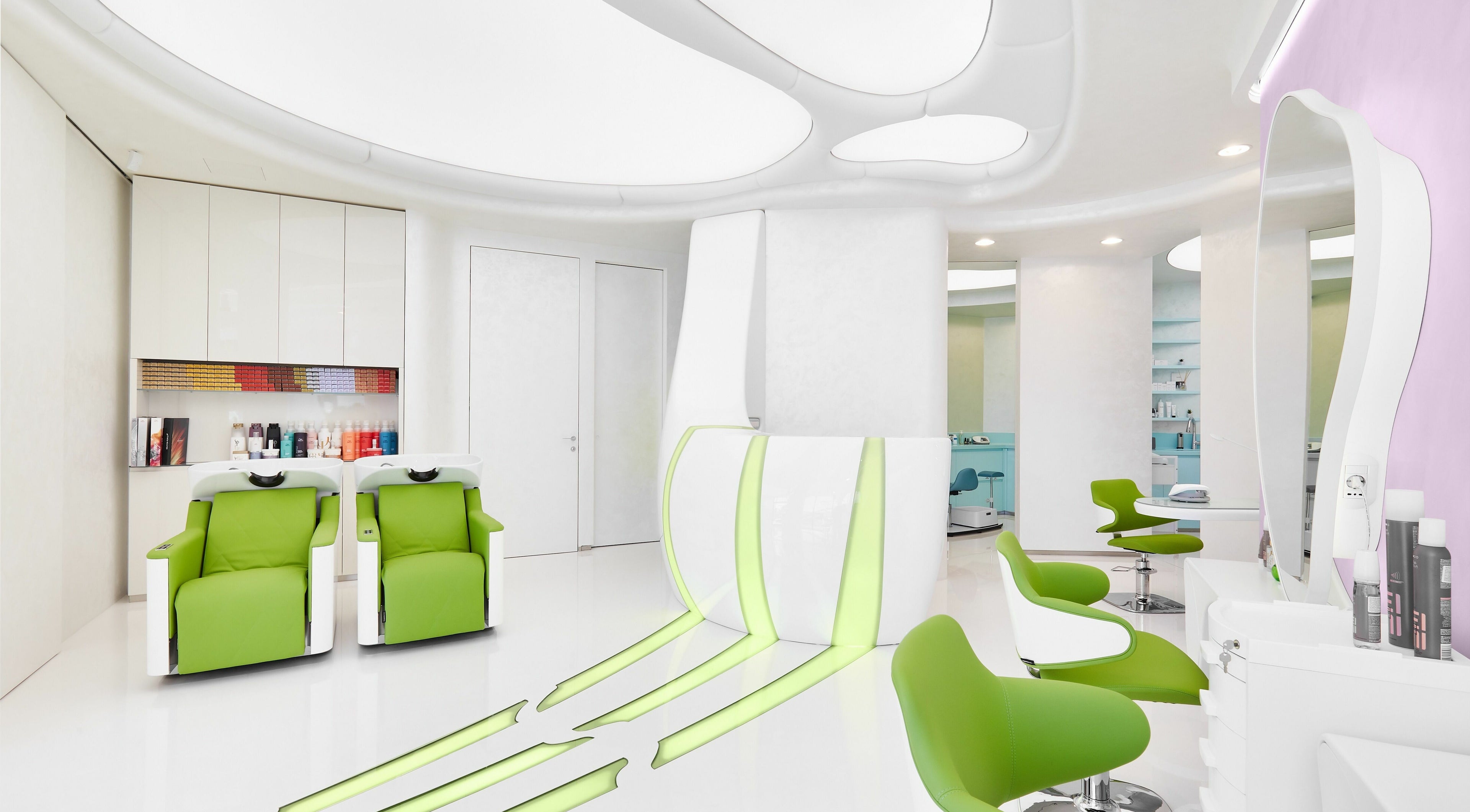 Chic interior of Hairspray salon in Sofia, Sofia City Province, BG with sleek green chairs and stylish decor.