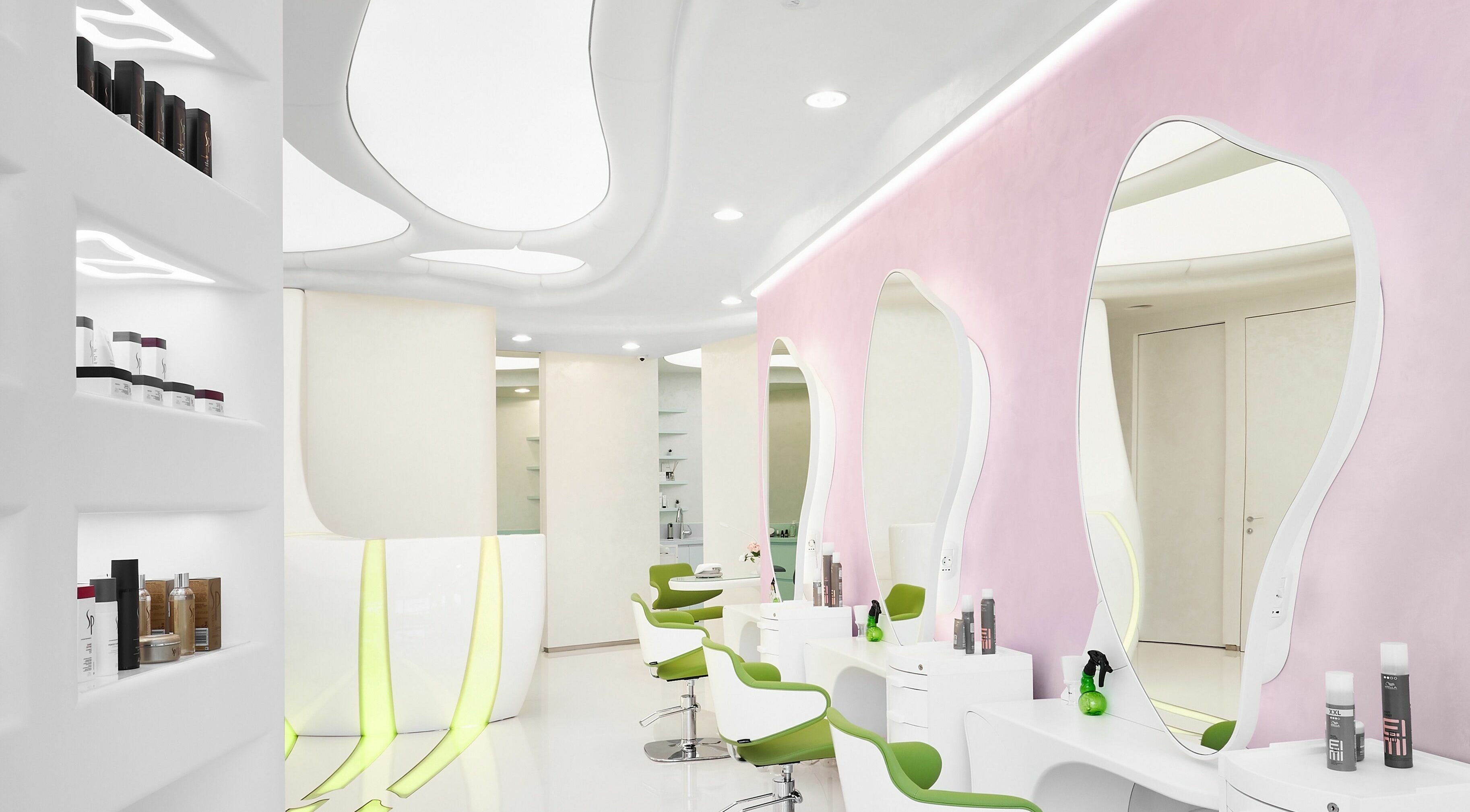 Modern salon interior at Hairspray, Sofia, Sofia City Province, BG, featuring stylish stations and vibrant decor.