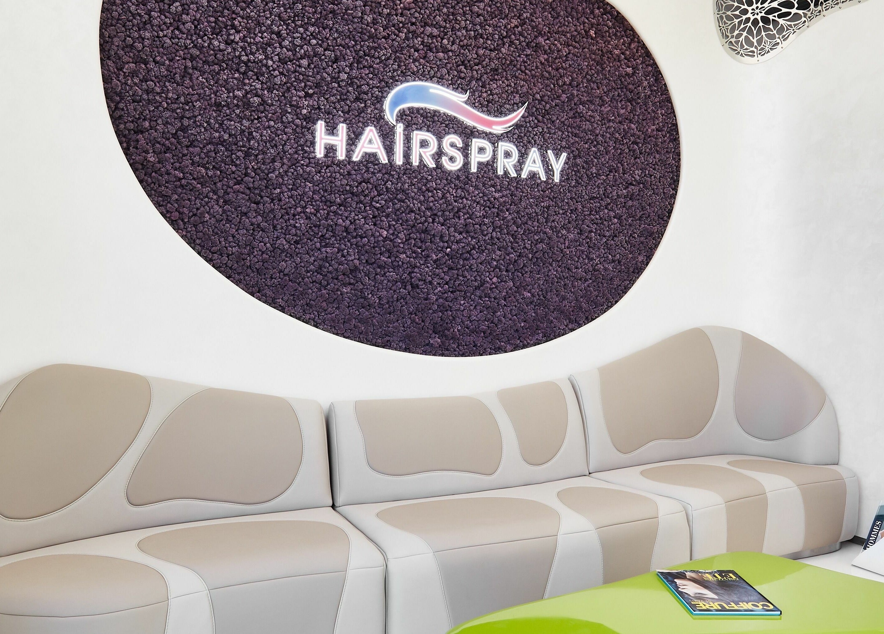 Modern lounge area at Hairspray in Sofia, Sofia City Province, BG featuring chic seating and decor.