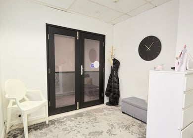 Elegant waiting area at Lash Bar, Bondi Junction, New South Wales, AU, showcasing modern decor and sleek design.