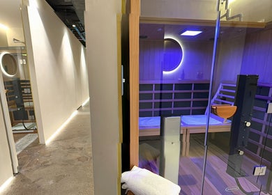 Luxurious sauna at Body WRL in Rosebery, NSW, AU featuring ambient lighting and modern wooden interior design.