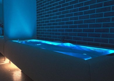 Relaxing hydrotherapy tub with blue lighting at Body WRL, Rosebery, NSW, AU.