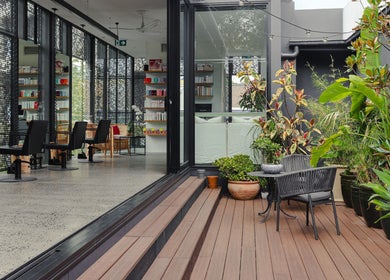 Elegant salon with lush plants at Willomina, Woollahra, New South Wales, AU.