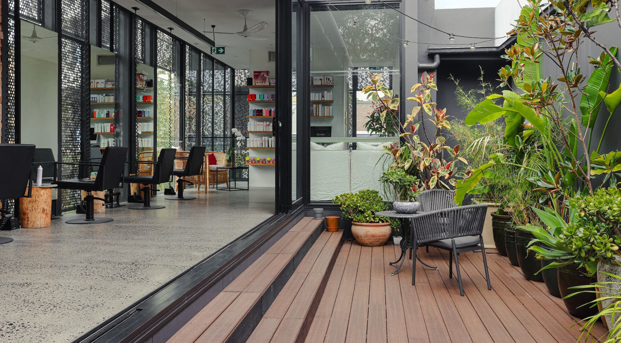 Elegant salon with lush plants at Willomina, Woollahra, New South Wales, AU.