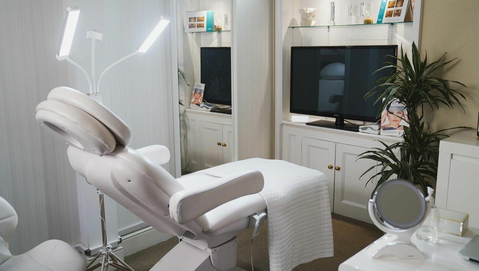 Luxurious treatment room at ARC Aesthetics and Laser, featuring a modern white chair in London, England, GB.