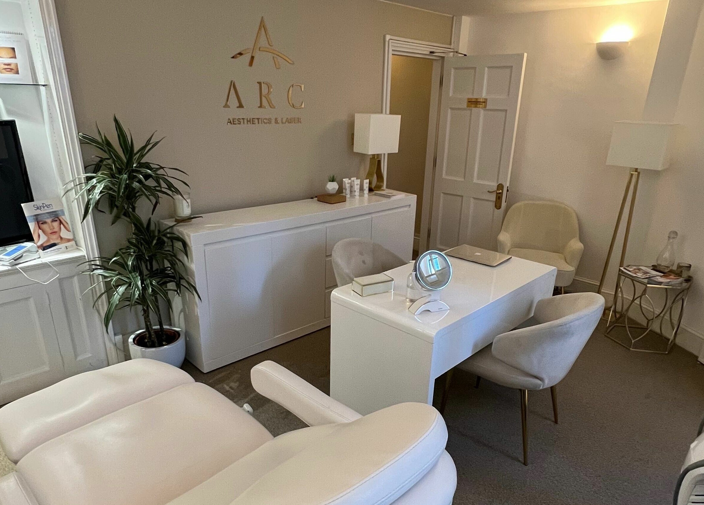 Modern and inviting treatment room at ARC Aesthetics and Laser in London, England, GB featuring plush seating.