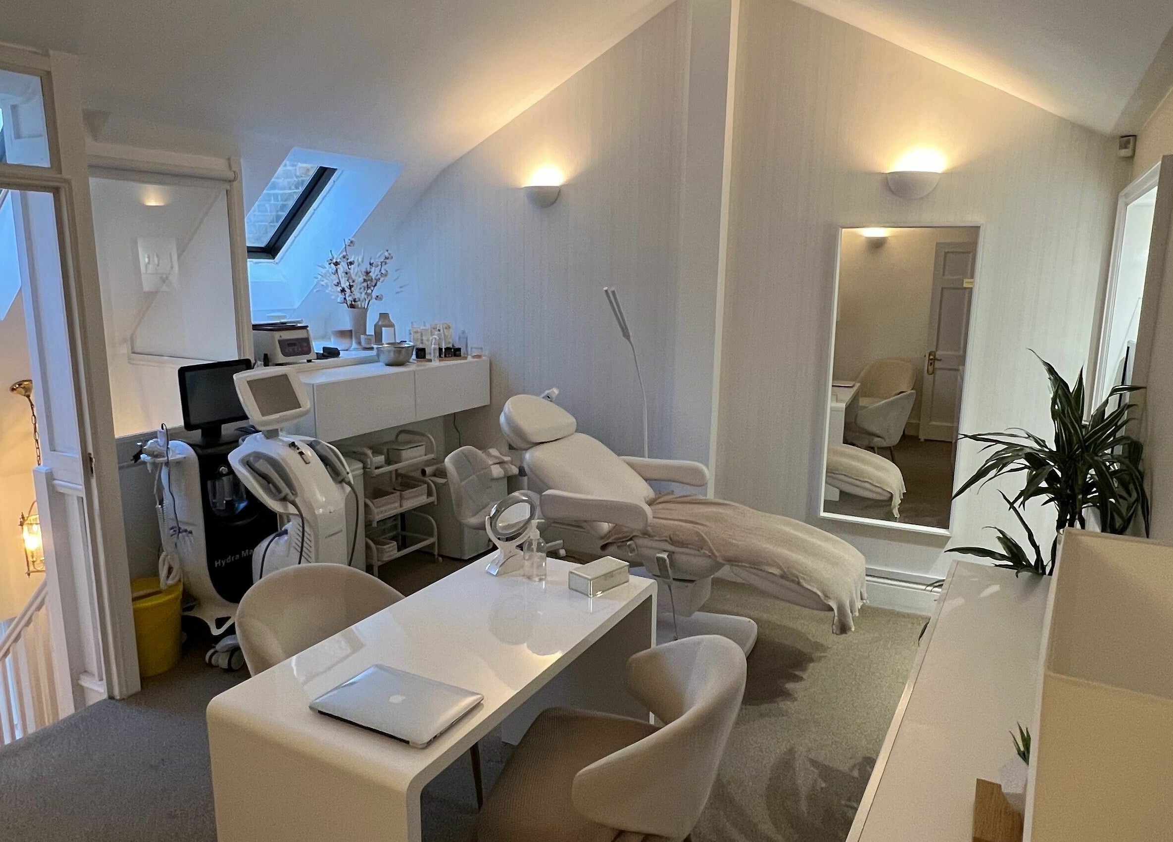 Modern treatment room at ARC Aesthetics and Laser, London, England, GB, featuring sleek decor and equipment.