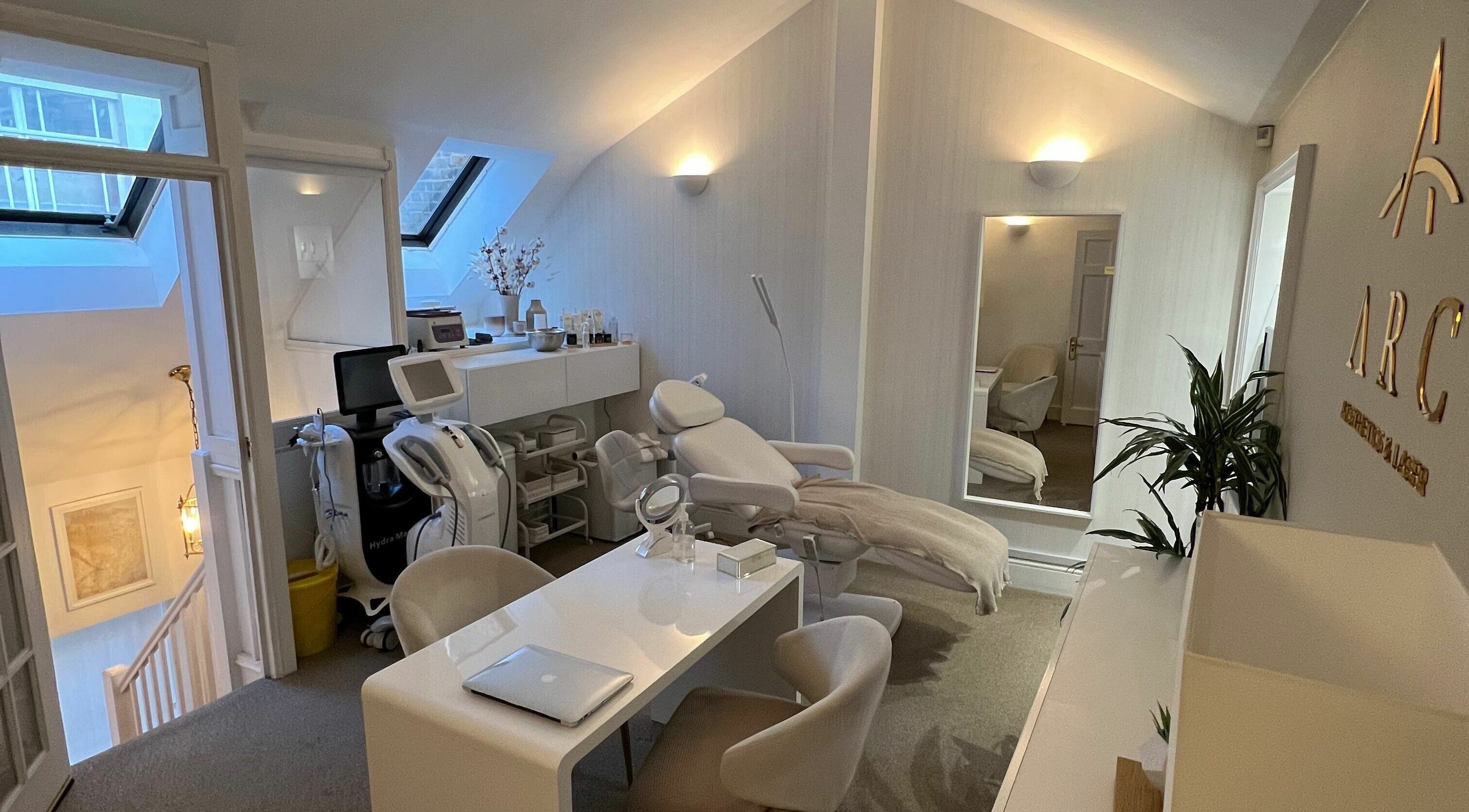 Modern treatment room at ARC Aesthetics and Laser, London, England, GB, featuring sleek decor and equipment.
