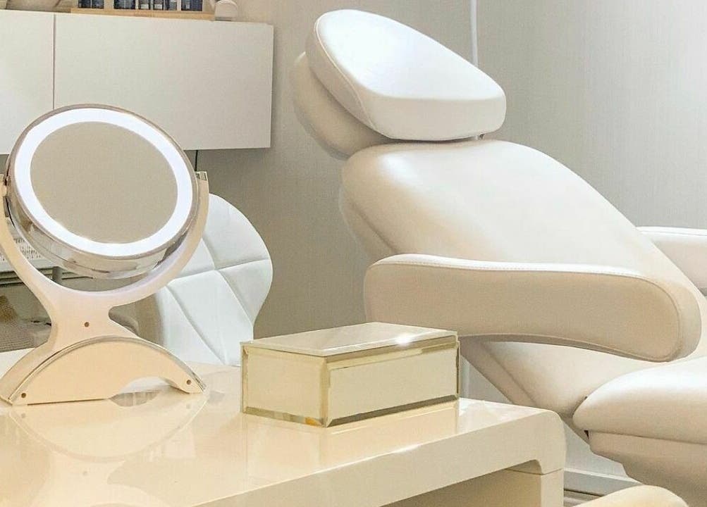 Calming spa chair and mirror at ARC Aesthetics and Laser, London, England, GB. Experience relaxation and beauty.