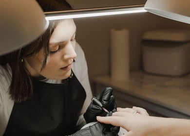 Manicurist perfecting nails at Create Beauty Studio, Hamilton, Waikato Region, NZ.