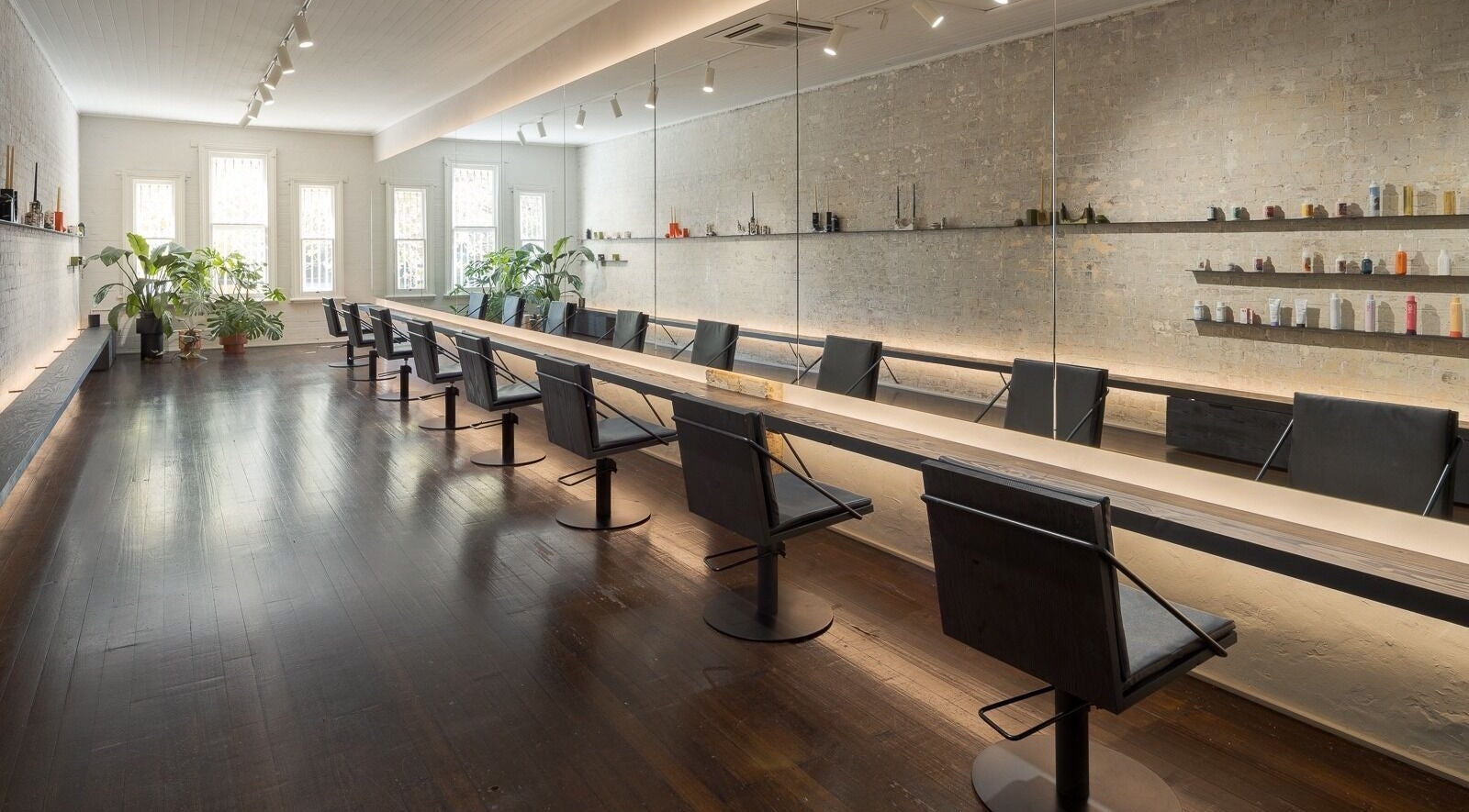 Elegant salon interior at A_STUDIO, Darlinghurst, New South Wales, AU with stylish chairs and mirrors.