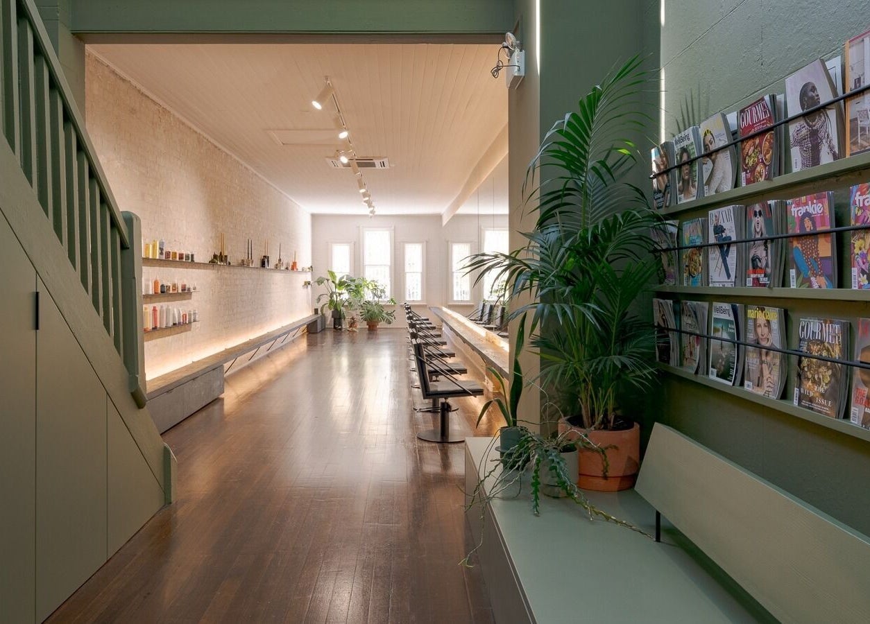 Chic interior of A_STUDIO with plants and magazines in Darlinghurst, New South Wales, AU.