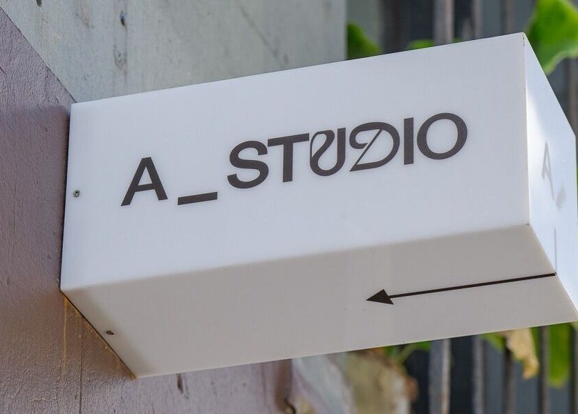 A_STUDIO signage at Darlinghurst, New South Wales, AU. Modern design highlights beauty and wellness venue.