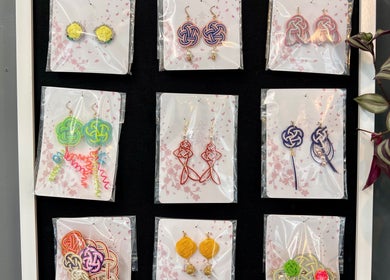 Unique earrings displayed at Blink Hair Design, Christchurch, Canterbury, NZ, offering elegant jewelry styles.