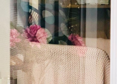 Cozy corner in Maa botanicals wellbeing studio, Franklin, ACT, AU with soft textures and floral decor.