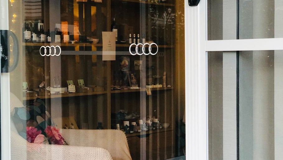 Cozy interior at maa botanicals wellbeing studio in Franklin, Australian Capital Territory, AU featuring display shelves.