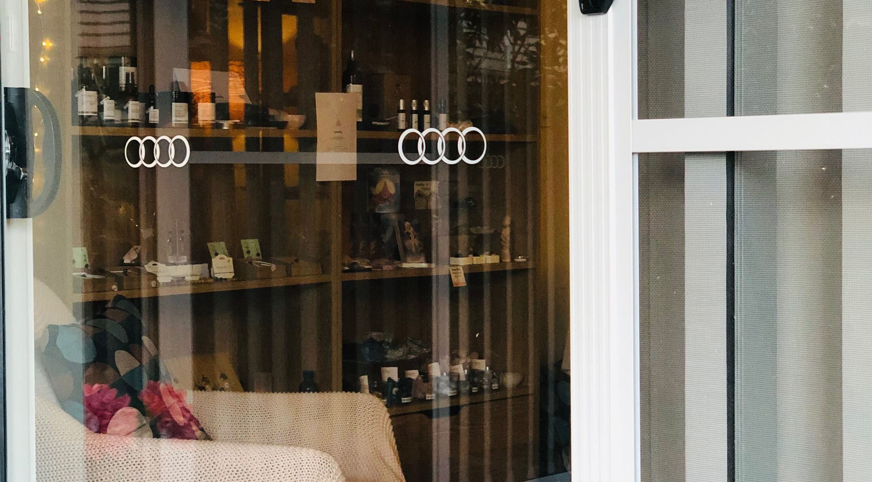 Cozy interior at maa botanicals wellbeing studio in Franklin, Australian Capital Territory, AU featuring display shelves.