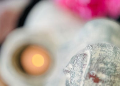 Close-up of candlelight and stone at maa botanicals wellbeing studio, Franklin, Australian Capital Territory, AU.